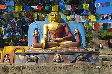 Nepal, Kathmandu, Buddha statue at the foot of the Swayambunath Monkey Temple.