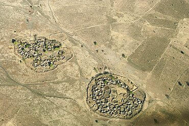 Uganda, Karamoja, Aerial views down on a traditional manyatta cattle korral.