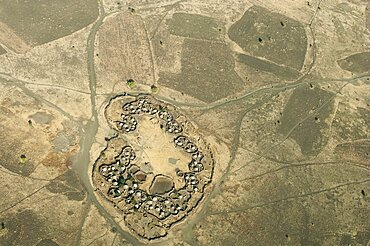 Uganda, Karamoja, Aerial views down on a traditional manyatta cattle korral.