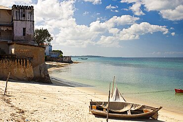 Tanzania, Zanzibar, Stone Town, Looking along the golden sands of the beach.