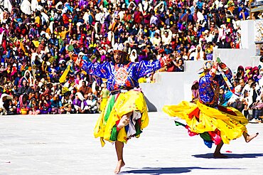 Bhutan, Thimphu Dzong, Dancers in traditional Buddhist costume for the Tsecchu, or Masked Dance.,