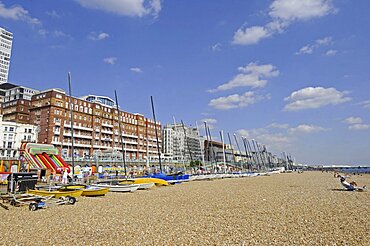 England, East Sussex, Brighton, View along the beach to Pier.