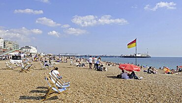 England, East Sussex, Brighton, View along the beach to Pier.