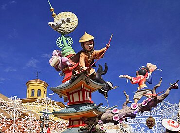 Spain, Valencia Province, Valencia, Oriental Fallas scene with Papier Mache figures in the street during Las Fallas festival.