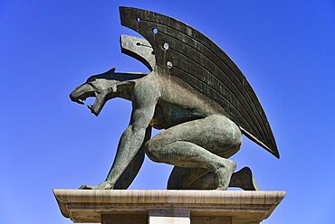 Spain, Valencia Province, Valencia, Puente del Reino, A gargoyle at the entrance to the bridge, Puente del Reino is one of many bridges over the former Rio Turia which now serves as a park as the river has been diverted due to constant flooding of the city. ,