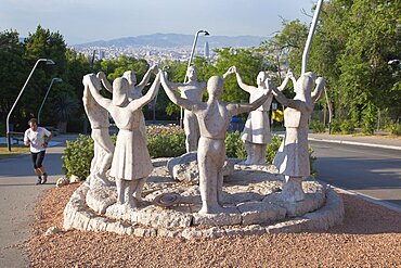 Spain, Catalonia, Barcelona, Monumento a la Sardana stone sculpture in Parc de Montjuic depicting the Catalan national dance.