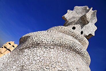 Spain, Catalunya, Barcelona, Antoni Gaudi's La Pedrera building, a section of chimney pots on the roof terrace.