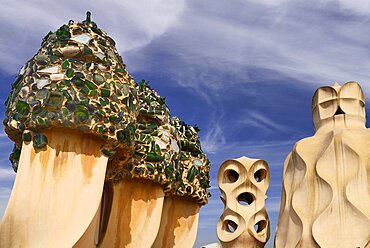 Spain, Catalunya, Barcelona, Antoni Gaudi's La Pedrera building, a section of chimney pots on the roof terrace.