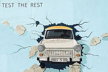 Germany, Berlin, The East Side Gallery, a 1.3 km long section of the Berlin Wall, Birgit Kinder's mural known as 'Test the Best'.