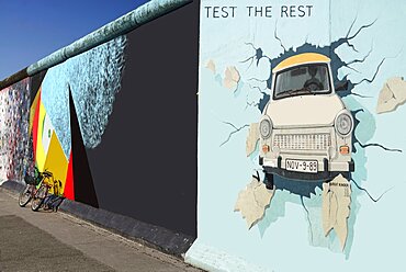 Germany, Berlin, The East Side Gallery, a 1.3 km long section of the Berlin Wall, Birgit Kinder's mural known as 'Test the Best' .