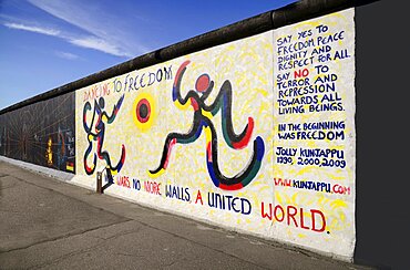 Germany, Berlin, The East Side Gallery, a 1.3 km long section of the Berlin Wall, Mural by Jolly Kunjappu called 'Dancing to Freedom'.