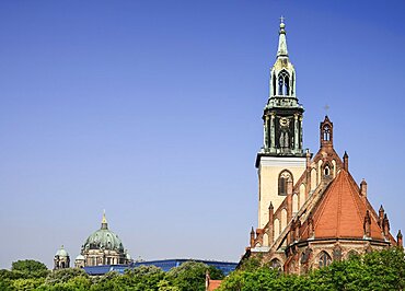 Germany, Berlin, Marienkirche, St Marys Church dating from the 13th Century with the dome of Berliner Dom in the background.