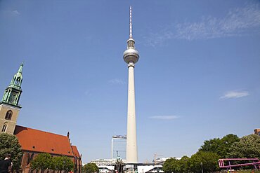 Germany, Berlin, Mitte, Fernsehturm TV Tower seen from St Marienkirche and Neptunbrunnen in Alexanderplatz.