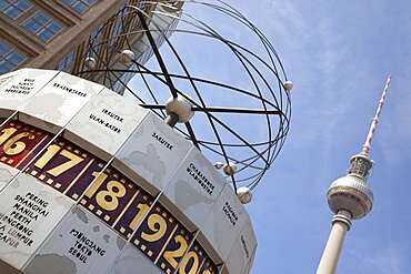 Germany, Berlin, Mitte, Alexanderplatz, the World Clock with Fernsehturm TV Tower behind.