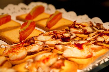 Spain, Madrid, Tapas on sale at the Mercado San Miguel.