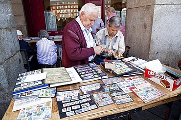 Spain, Madrid, Stamp collectors in the Plaza Mayor.