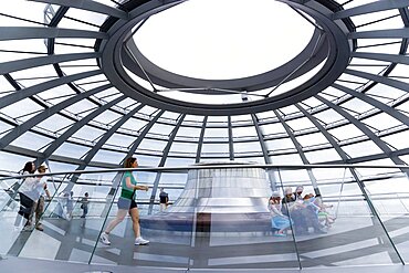 Germany, Berlin, Mitte, Tiergarten, interior of the glass dome on the top of the Reichstag building designed by architect Norman Foster with the hot air vent on top of the mirrored cone that reflect light into the debating chamber of the Bundestag below.