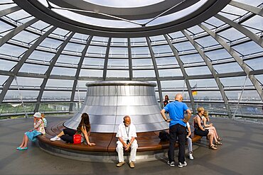 Germany, Berlin, Mitte, Tiergarten, interior of the glass dome on the top of the Reichstag building designed by architect Norman Foster with the hot air vent on top of the mirrored cone that reflect light into the debating chamber of the Bundestag below.