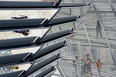 Germany, Berlin, Mitte, Tiergarten, interior of the glass dome on the top of the Reichstag building designed by architect Norman Foster with a double-helix spiral ramp around the mirrored cone that reflect light into the debating chamber of the Bundestag below.