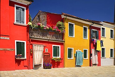 Italy, Veneto, Burano Island, Colourful row of house facades.