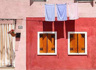 Italy, Veneto, Burano Island, Colourful row of house facades.