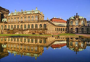 Germany, Saxony, Dresden, Zwinger Palace, Glockenspiel Pavilion reflected in pool.