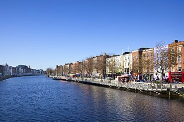 Ireland, Dublin, View along the River Liffey toward the Ha'penny bridge.