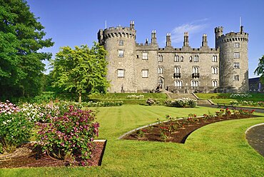 Ireland, County Kilkenny, Kilkenny, Kilkenny Castle with the Rose Garden in the foreground.