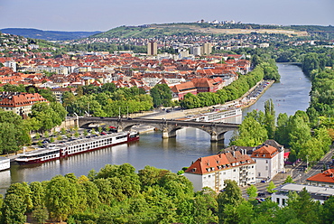 Germany, Bavaria, Wurzburg, View eastwards from Festung Marienburg fortress over the River Main with cruise boats.