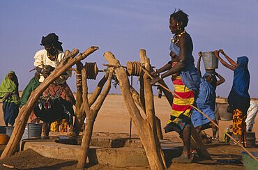 MALI Sahara Near Nampala Fulani women drawing water at a well