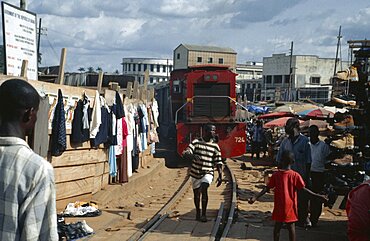 GHANA Kumasi Train running through busy market