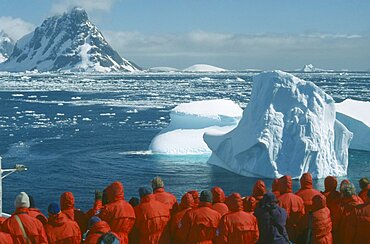 ANTARCTICA Antarctic Peninsula Tourists Tourist group looking at iceberg from cruise ship near the Lemaire Channel.