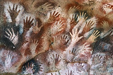 ARGENTINA Patagonia Cueva de las Manos Cave of the Hands.  Prehistoric rock paintings of human hands in red black and orange 13 000 to 9 500 years old.