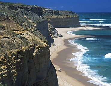 AUSTRALIA Victoria Near Port Campbell Great Ocean Road. View along rugged rocky cliffs and sandy beach