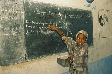 SOMALIA  Baidoa Dr Ayub Primary School.  Pupil at blackboard.