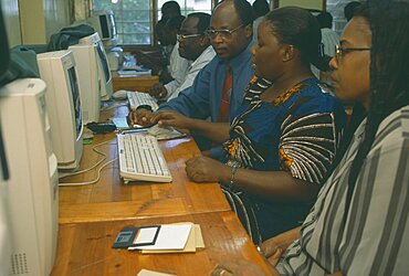 TANZANIA  Dar es Salaam Adult students learning computer skills.