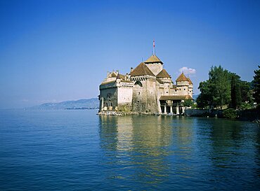 SWITZERLAND Vaud Chateau de Chillon View over Lake Geneva towards the 13th century castle.