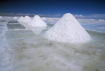 BOLIVIA Altiplano Potosi Salar de Uyuni. Salt mounds ready for collection