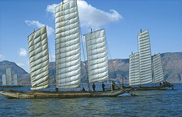 CHINA Yunnan Province Kunming Lake Fishing boats in full sail.