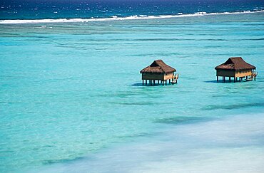 WEST INDIES St Vincent & The Grenadines Canouan Offshore treatment rooms of the Amrita Spa off Godahl Beach at Raffles Resort with the coral reef beyond