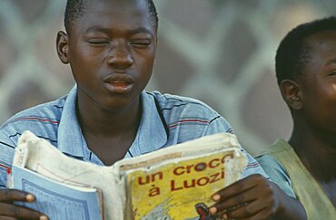 CONGO  Education Boy reading from French book.  Zaire