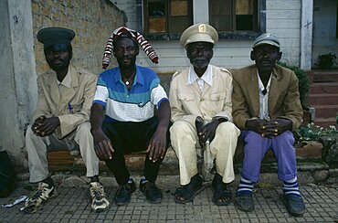 ANGOLA  Malange Four Malange chiefs seated and wearing different hats.