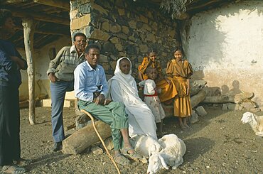 ERITREA  Seraye Province Farming family outside home with sheep.