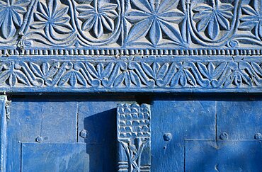 SOMALIA  Mogadishu Detail of blue painted doorway with carved plant motif.