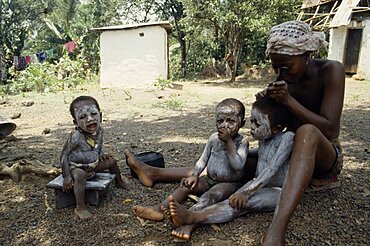 SIERRA LEONE  Mende Children are smeared with clay to protect them from both seen and unseen dangers.