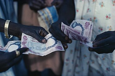 NIGERIA  Money Cropped shot of money changing hands. transaction  sale