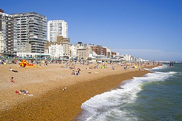 ENGLAND East Sussex Brighton The beach with seafront apartment building behind. Great Britain United Kingdom