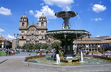 PERU  Cusco Iglesia La Compania de Jesus  and ornate fountain  Plaza de Armas. Cuzco Travel Tourism Holiday Vacation Explore Recreation Leisure Sightseeing Tourist Attraction Tour Destination Plaza De Armas Cusco Cuzco Peru Peruvian South Southern America Latin Sacred Valley Of The Inca Incas Inka Incan Vivid Vibrant City Town Square Tranquil Tranquility Tradition Traditional Culture Cultural Building Architecture Architectural Ethnic UNESCO World Heritage Site Andes Andean Spanish Colonial Iglesia La Compania Jesus Jesuit Spectacular Beautiful Blue Sky Magnificent Church Churches Religion Religious Pray Prayer Worship Worshipping Worshiping Christianity Holy Divine Christian Theology Faith Sacred Devout Catholic Catholicism Impressive Majestic Baroque Faade Bell Tower Spire Steeple Landmark Fountain Fuente Water Calendar American South America