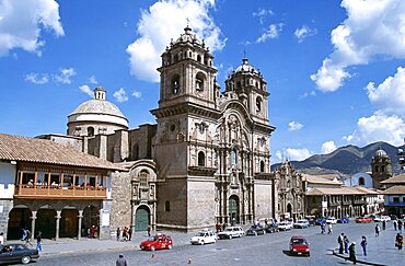 PERU  Cusco Iglesia La Compania de Jesus  Plaza de Armas. Cuzco Travel Tourism Holiday Vacation Explore Recreation Leisure Sightseeing Tourist Attraction Tour Destination Plaza De Armas Cusco Cuzco Peru Peruvian South Southern America American Latin Sacred Valley Of The Inca Incas Inka Inkas Incan City Town Square Tradition Traditional Culture Cultural Building Architecture Architectural Ethnic UNESCO World Heritage Site Andes Andean Spanish Colonial Iglesia La Compania Jesus Jesuit Spectacular Beautiful Blue Sky Magnificent Church Churches Religion Religious Pray Prayer Worship Worshipping Worshiping Christianity Holy Divine Christian Theology Faith Sacred Devout Catholic Catholicism Impressive Majestic Baroque Faade Bell Tower Spire Steeple Landmark Road Cars Traffic People Fluffy White Clouds Calendar South America