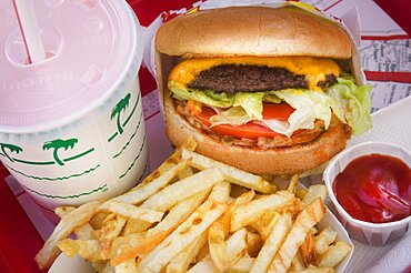 FOOD Fast Burger Cheeseburger  fries and strawberry milkshake. America USA icon food cholesteral fat temptation chips ketchup hamburger fastfood comfort Shake American Crisps French Fries Frites North America United States of America